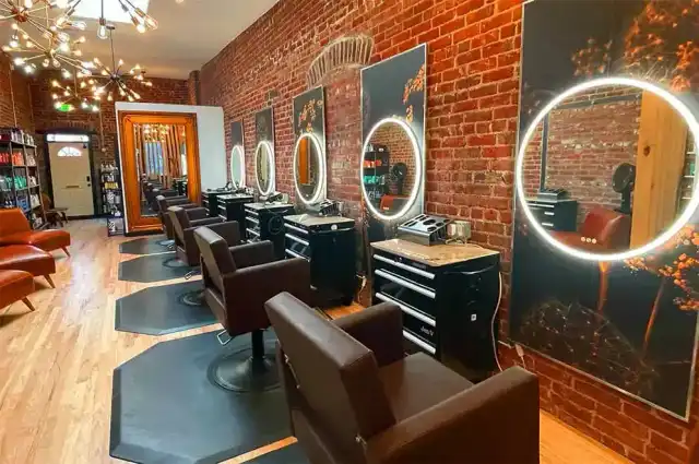 Barber finishing a skin fade on a client